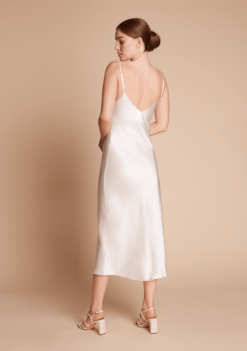 white silk slip dress in midi length 